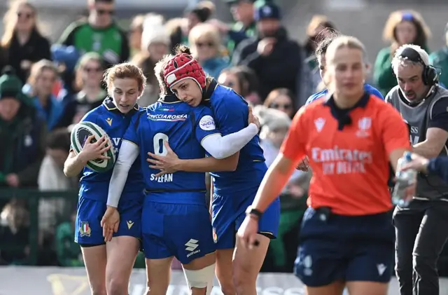 Italy celebrate scoring a try