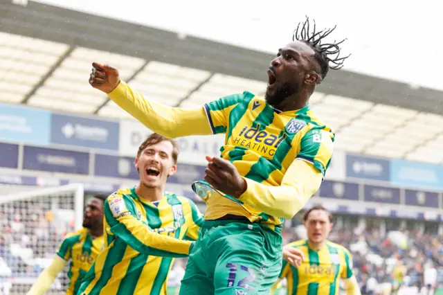 Daryl Dike of West Bromwich Albion scores a goal and celebrates