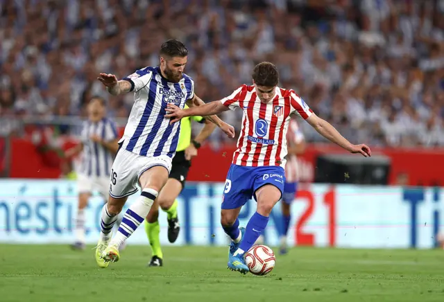 Julian Alvarez of Atletico de Madrid runs with the ball