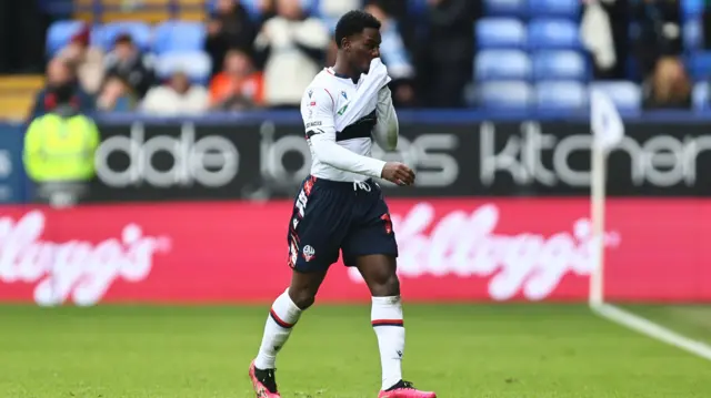 Jordi Osei-Tutu walks off after his red card for Bolton