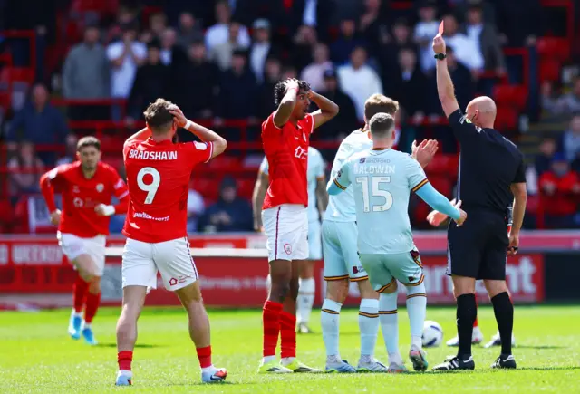 Vimal Yoganathan is shown red for Barnsley
