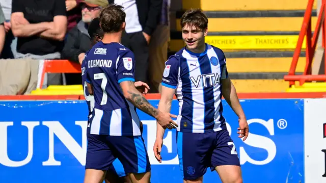 Stockport celebrate their second goal at Exeter