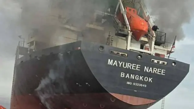 A photo shows the Thaiflagged cargo ship Mayuree Naree on fire after being hit by Iranian missiles in the Strait of Hormuz, Iran, 11 March 2026