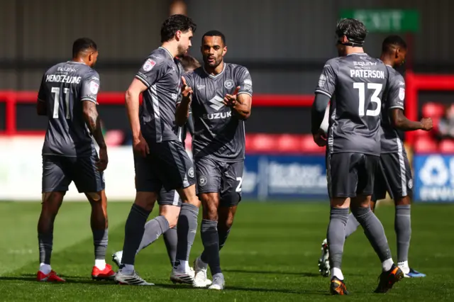 Curtis Nelson celebrates MK Dons' first goal at Crewe