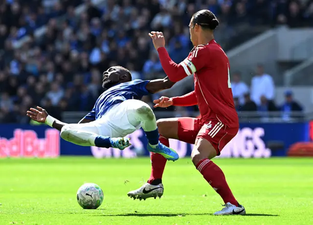 Idrissa Gueye of Everton is challenged by Virgil van Dijk of Liverpoo