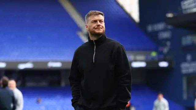Kim Hellberg walking on the Portman Road pitch ahead of kick-off