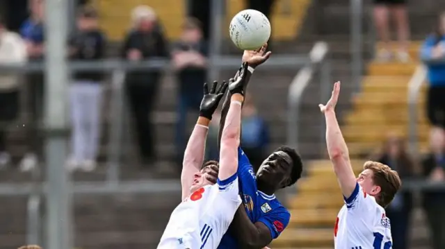 Emmanuel Shehu competes for the ball