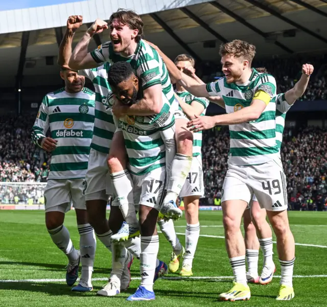 Celtic's Kelechi Iheanacho celebrates with his teammates after scoring to make it 5-2 during a Scottish Gas Scottish Cup semi-final match between Celtic and St Mirren at Barclays Hampden, on April 19, 2026, in Glasgow, Scotland.