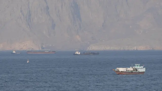 Ships and tankers in the Strait of Hormuz off the coast of Musandam, Oman.