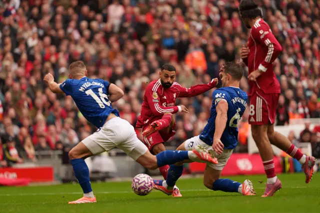 Liverpool's Mohamed Salah takes a shot against Everton