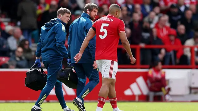 Nottingham Forest walks off the pitch with the medical team after an injury during