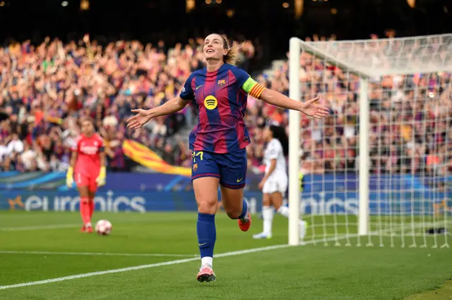 Alexia Putellas runs to celebrate scoring the opener