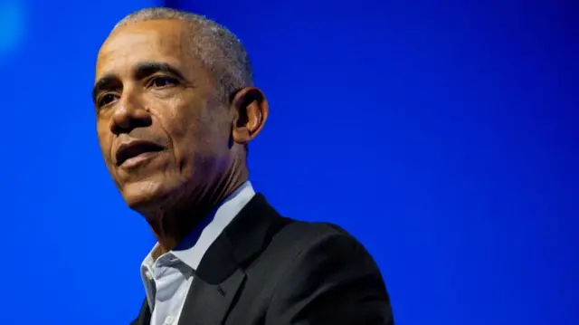 A headshot of Barack Obama against a blue blackground