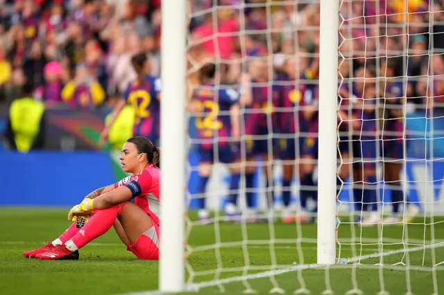 Misa sits on the floor after conceding the fourth goal