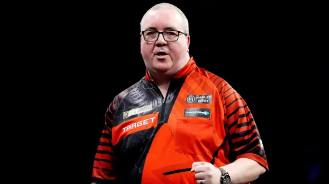 England's Stephen Bunting celebrates winning his match against Netherlands' Michael van Gerwen on night nine of the BetMGM Premier League 2026 at the AO Arena, Manchester