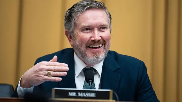 Massie smiles and gestures during a congressional hearing