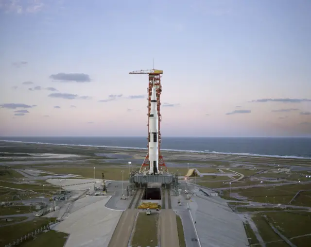 A space rocket is seen at the Kennedy Space Centre at Cape Canaveral in Florida, with the sea seen in the background and clouds interspersed across the sky