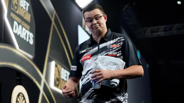 Netherlands' Gian van Veen reacts after defeating England's Luke Littler on night nine of the BetMGM Premier League 2026 at the AO Arena, Manchester