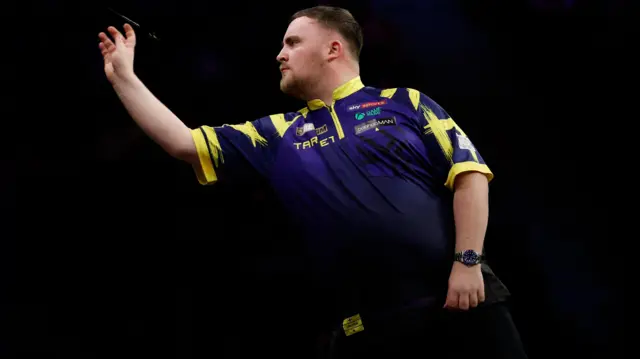 Luke Littler in action during his quarter finals match against Gian van Veen