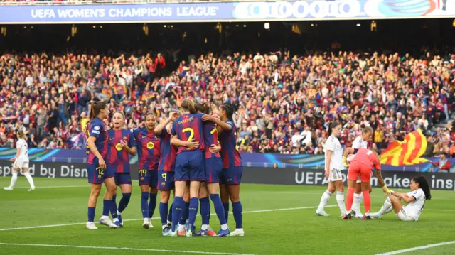 Barcelona celebrate another goal as Madrid players slump to the floor