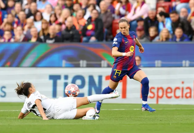 Pajor tries to break past a defender