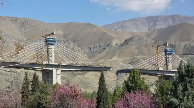 A large bridge with a large gap in the middle of it