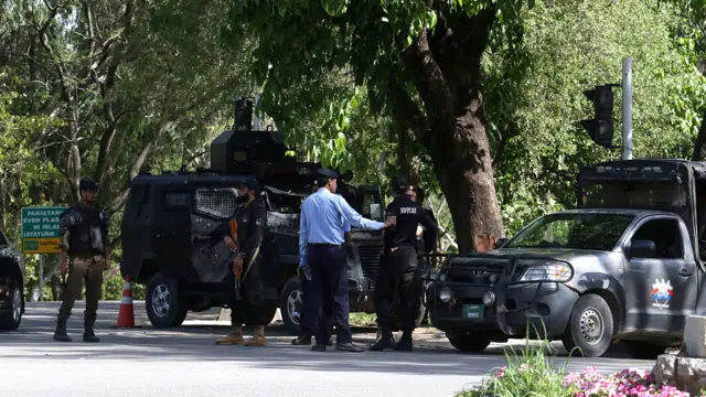 Pakistani security officials guard a road ahead of the expected arrival of a US delegation in Islamabad, Pakistan, 20 April 2026