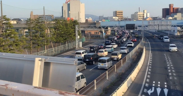 Verified image of a busy road in north-east Japan as people attempt to leave the coast after an earlier tsunami warning