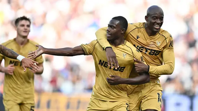 Tyrick Mitchell of Crystal Palace celebrates with Jean-Philippe Mateta