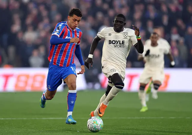 Brennan Johnson of Crystal Palace runs with the ball while under pressure from El Hadji Malick Diouf
