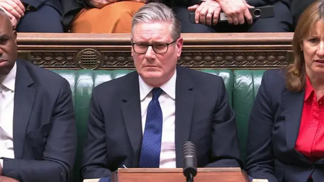 Starmer, Lammy and Reeves looking displeased on the front bench in the House of Commons
