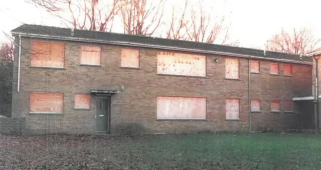 A boarded up children's home.