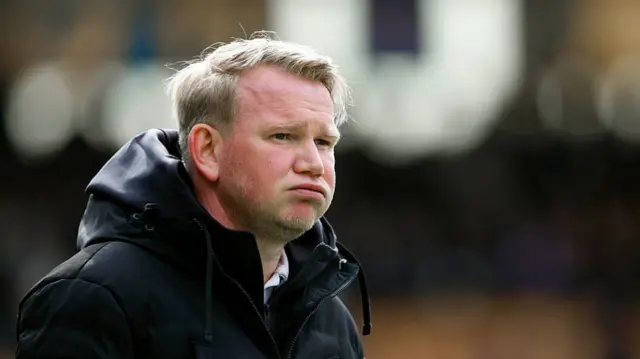 Tranmere manager Pete Wild looking exasperated