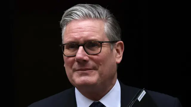 A photograph of UK Prime Minister Keir Starmer cropped from the shoulders up.