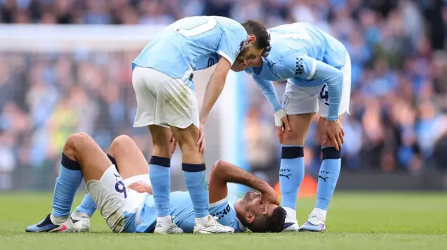 Rodri of Manchester City lies injured