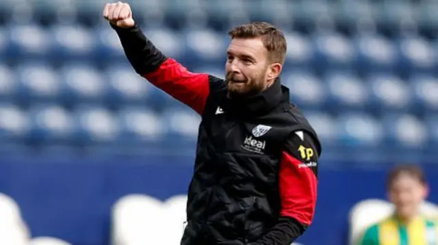 West Brom interim head coach James Morrison punches the air