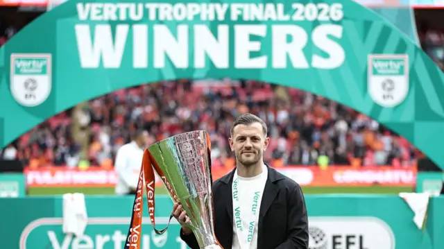 Luton boss Jack Wilshere holding the EFL Trophy