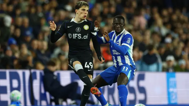 Alejandro Garnacho in action with Brighton & Hove Albion's Yankuba Minteh