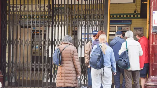 Commuters stand outside a closed Russell Square station as London Underground drivers, represented by RMT (National Union of Rail, Maritime and Transport Workers) begin their strike over the proposal to allow train operators to shift to a compressed four-day week.
