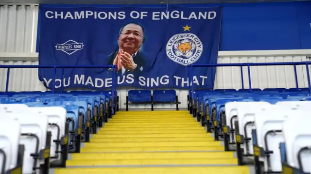 A banner at the back of Leicester's King Power Stadium reading, 'Champions of England, you made us sing that' in tribute to late owner Vichai Srivaddhanaprabha
