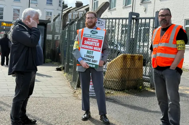 Members of the Rail, Maritime and Transport union (RMT) at the Queen's park depot picket line, London