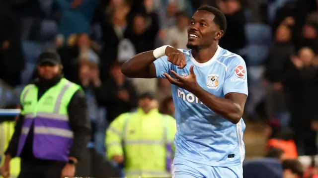 Ephron Mason-Clark celebrates in front of the Coventry fans