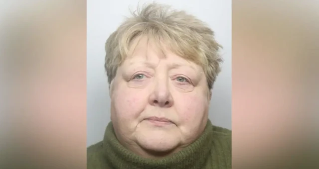 A mugshot of Linda Brunning. She is wearing a green jumper with a high collar.