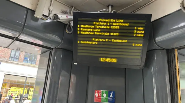 Screen showing train times at Covent Garden Station