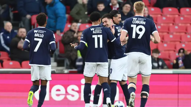 Millwall players celebrate with Camiel Neghli