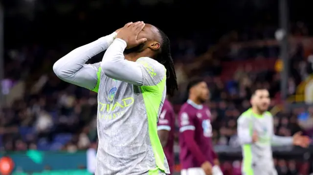 Antoine Semenyo has his head in his hands