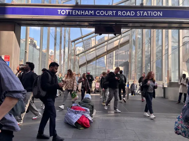 People walking about of Tottenham Court Road station entrance