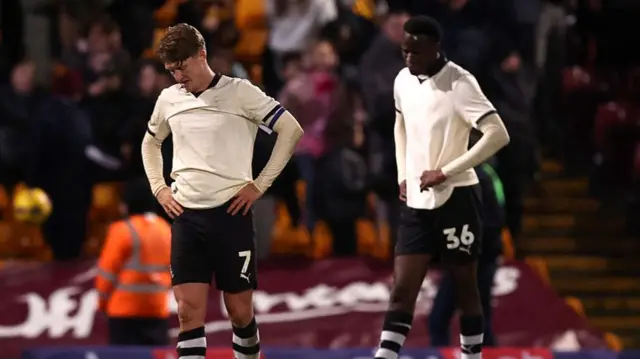 George Byers of Port Vale looks dejected after a defeat
