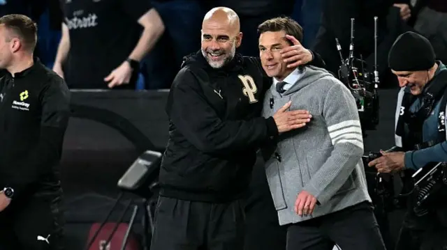 Manchester City's manager Pep Guardiola reacts with Burnley's manager Scott Parker