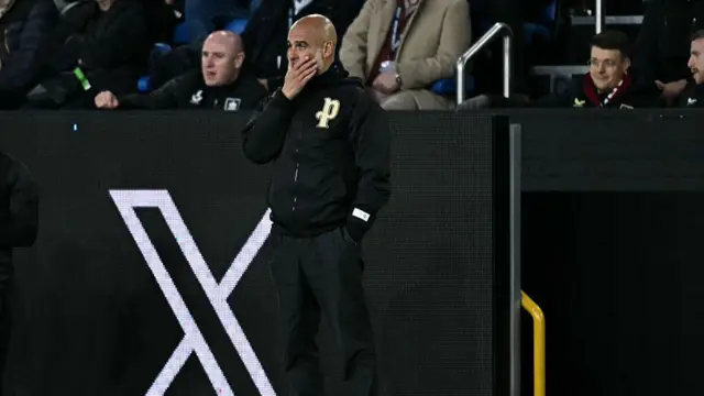 Manchester City's manager Pep Guardiola watches the players from the touchline